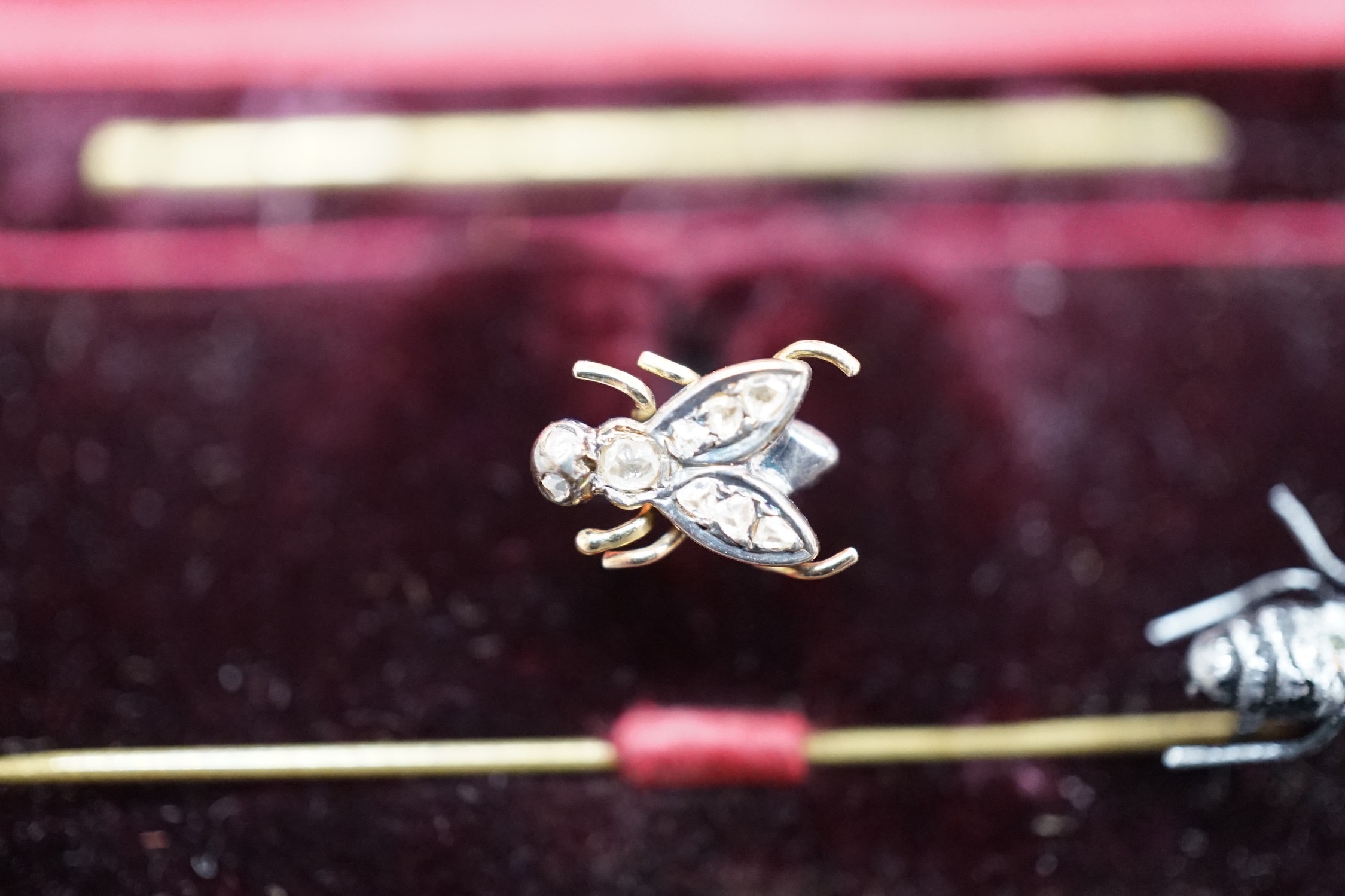A 19th century yellow metal and rose cut diamond set 'fly' stud, 8mm and a bug stick pin.